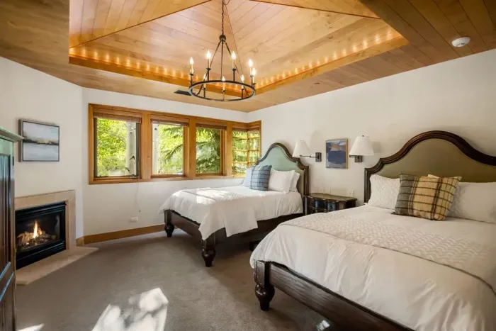 Wing 2 bedroom 6 with 2 queen beds and a gas fireplace.