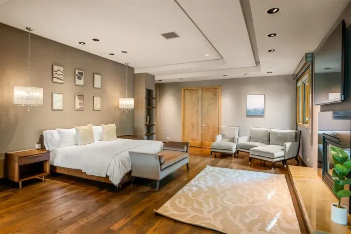 Wing 1 primary bedroom with king bed and private sitting room.