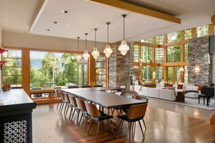 Expansive open-concept dining room with aspen tree valley views