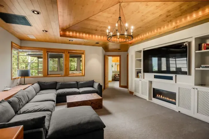 Wing 2 upstairs private family room with TV and fireplace. This room is attached to bedroom 5 and 6.