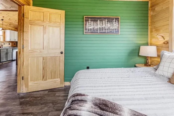 Primary bedroom with king bed and nature art 