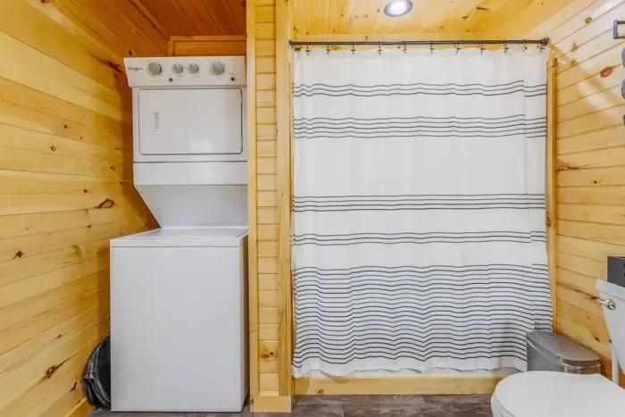 The Woodlands bathroom with stackable washer and dryer